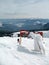 Ski lift on snow covered mountain peaks on high.