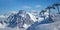 Ski lift and snowy peaks in the Alps