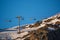 Ski lift during sunset on mountain slope in Alpe D\'Huez ski resort - France