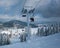 Ski lift at the top in snowy mountains lifts person up the slope, winter active vocations