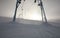 Ski lift in winter snow overcast landscape in misty mountains