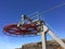 Ski lifts for skiers on the slopes and tops of a mountain, machinery with towers, gears, wheels and cables to take skiers to the