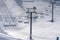 Ski lifts and sunlit snow covered slope in Utah