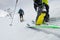 Ski mountaineering boot detail during ascent in the snow