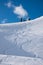 Ski piste with deep powder snow and tracks from skiing or snowboard