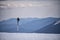 Ski poles against the backdrop of majestic snow-capped mountains.