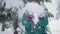 Ski resort entertainments. Happy young woman playing with snow slow motion