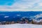 Ski resort. Freeride. Young guy on a snowboard in the mountains Sheregesh. Caucasian snowboarder on a background of blue sky .