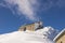 Ski resort in Poland. High mountain Tatras. Peak Kasprowy near Zakopane with meteorological observatory. Winter time.