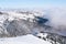 Ski resort, ski lift, mountain view, fog