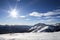 Ski resort.Ski slopes.Sunny day at the ski resort.Panoramic view on snowy off piste slope for freeriding with traces from skis, sn