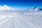 Ski slope in the mountains. Sunny winter landscape