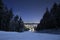 Ski slope in Poiana Brasov winter resort, Romania. Dark scenery. Night long exposure.