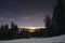 Ski slope in Poiana Brasov winter resort, Romania. Dark scenery. Night long exposure