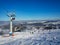 Ski slope with skiers, snowboarders and chairlift