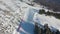 Ski slope. Skiers and snowboarders roll down the track. Aerial photography of a skier descending a wide ski slope