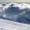 Ski slope for slalom and sunlight storm cloud