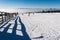 Ski slope, Snowy pathway with wooden fence in wintertime