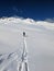 Ski tourers make a lonely track through the deep snow in the mountains above Davos. Ski mountaineering in the Swiss Alps