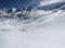 Ski tourers make a lonely track through the deep snow in the mountains above Davos. Ski mountaineering in the Swiss Alps