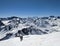 Ski touring couple on the ascent towards the Schwarzhorn near Davos. Mountains. Ski mountaineering in the Swiss Alps