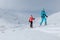 Ski touring couple hiking up a mountain in the Low Tatras in Slovakia.