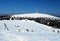 Ski tow, Petrovy kameny and Praded hill in winter Jeseniky mountains