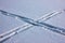 Ski track crossing on the fresh snow. Snow texture with skiing traces