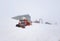 Ski track vehicle buried in snow on top of the mountain