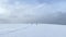 Ski trip across the expanses of Russia. Beautiful winter landscape. A group of skiers is skiing on a snow-white field