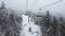 Ski winter vacation concept video. Ski lift and gondola. First person view POV with skis. Skiing on snow slopes in the