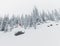 Skier in the backcountry of a snowy mountain landscape near Rossland Range, Canada