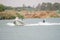 Skier and boat on the Riet River