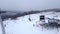 skier at chairlift aerial view