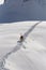 Skier climbing a snowy mountain