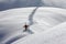 Skier climbing a snowy mountain