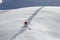 Skier climbing a snowy mountain