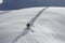 Skier climbing a snowy mountain