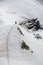 Skier climbing a snowy mountain