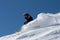 Skier in clouds of snow powder