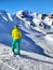 Skier Contemplating Snowy Mountain Slopes