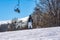 Skier descends a steep slope from a mountain