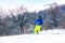 Skier descends a steep slope from a mountain