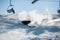 Skier falling with fresh snow powder on the slope