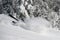 Skier falling on the slope on fresh powder snow