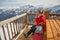 SKier having a sandwich on a terrace with scenic view