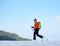 Skier hiker with backpack on skis in deep white snow on background of beautiful winter landscape.