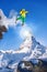 Skier jumping against Matterhorn peak in Switzerland.