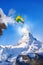 Skier jumping against Matterhorn peak in Switzerland.