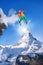 Skier jumping against Matterhorn peak in Switzerland.